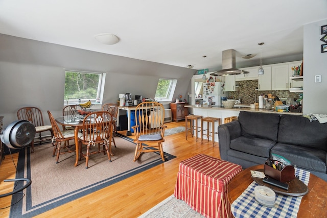 living room with light hardwood / wood-style flooring