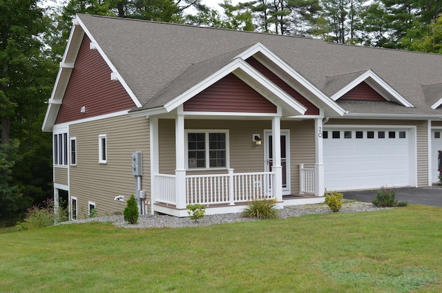 craftsman-style house with a garage, a porch, and a front lawn