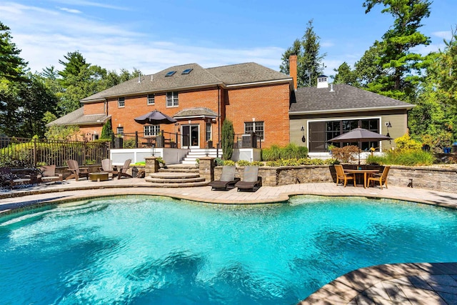 view of pool with a patio, fence, and a fenced in pool