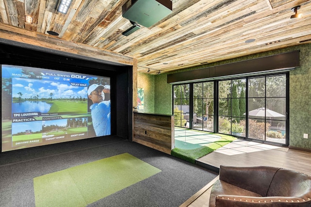 rec room with wood ceiling and golf simulator