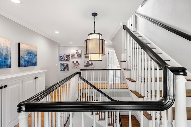 staircase featuring recessed lighting, wood finished floors, and ornamental molding