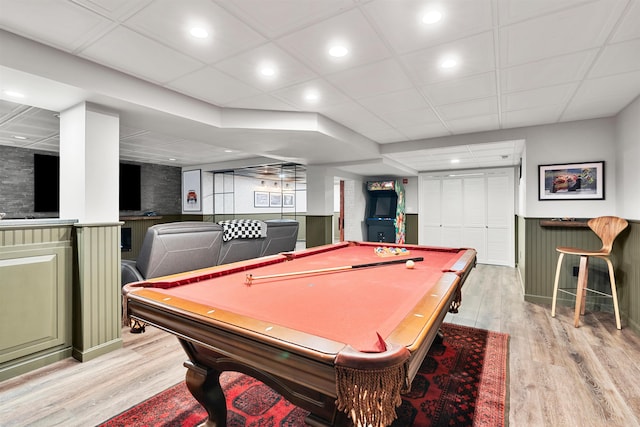 playroom featuring recessed lighting, a paneled ceiling, and light wood-style flooring