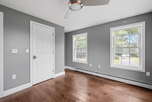 entryway featuring a towering ceiling and dark hardwood / wood-style flooring