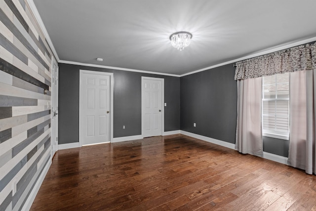 unfurnished bedroom with hardwood / wood-style floors and ornamental molding