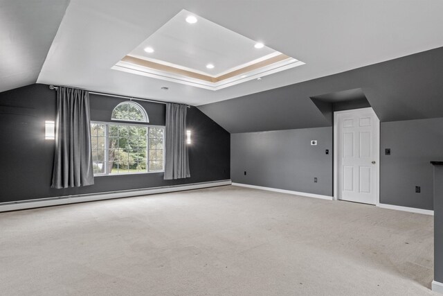 walk in closet featuring a baseboard heating unit, hardwood / wood-style floors, and vaulted ceiling