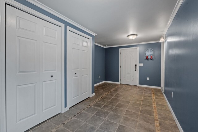 tiled spare room with crown molding