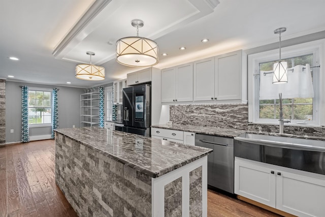 kitchen with black refrigerator with ice dispenser, dishwasher, tasteful backsplash, dark wood-type flooring, and white cabinetry