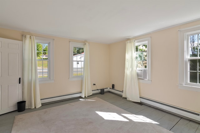 empty room featuring cooling unit, light tile patterned floors, baseboard heating, and ornamental molding