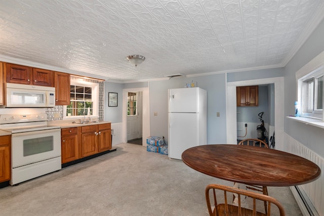 kitchen featuring light colored carpet, ornamental molding, sink, and white appliances