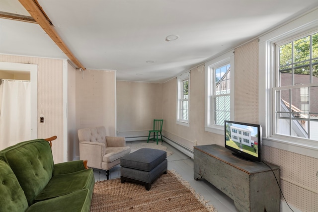 sitting room with baseboard heating and light tile patterned flooring