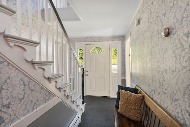 carpeted foyer with baseboard heating