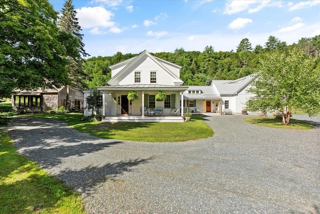 view of front facade featuring a front lawn and covered porch