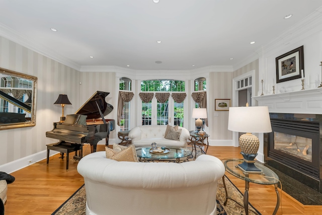 living room with crown molding and light hardwood / wood-style flooring