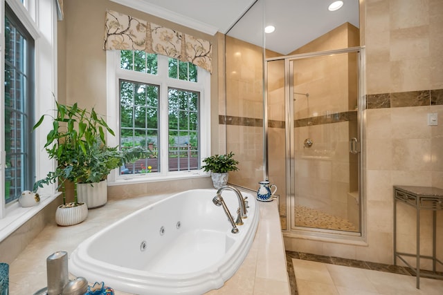 bathroom with shower with separate bathtub and tile patterned floors