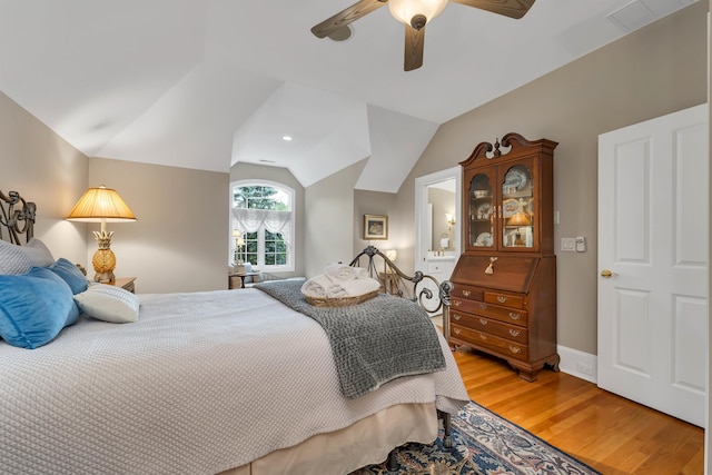 bedroom with lofted ceiling, ceiling fan, and light hardwood / wood-style floors