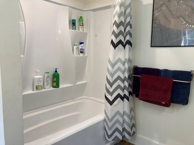 bathroom featuring shower / tub combo with curtain