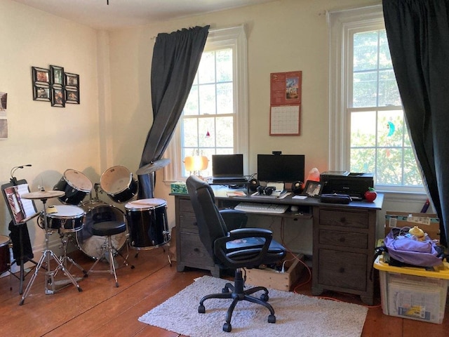 home office with wood-type flooring