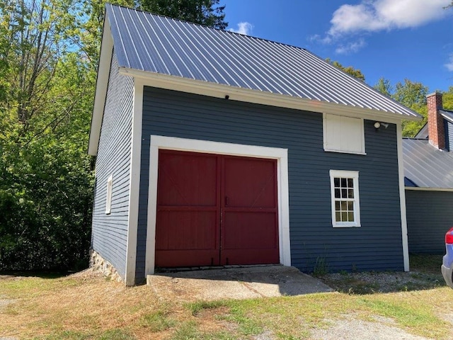 garage featuring a yard