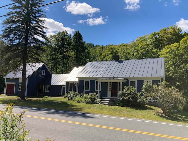 single story home with a front lawn and covered porch