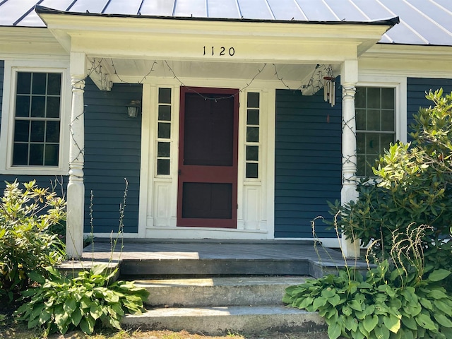 doorway to property featuring covered porch