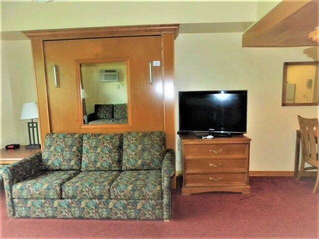 living room featuring baseboards and carpet