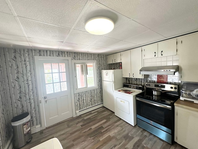 kitchen featuring white fridge, dark wood-type flooring, washer / dryer, electric range, and a baseboard heating unit