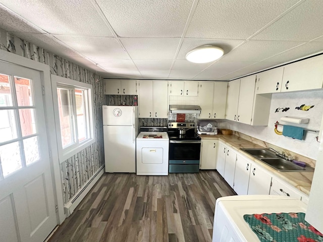 kitchen with white fridge, stainless steel electric stove, range hood, washer / dryer, and sink