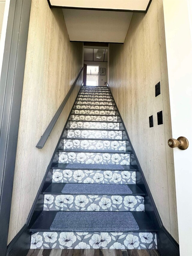 staircase featuring tile patterned floors