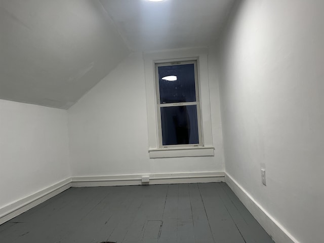 bonus room featuring hardwood / wood-style flooring and lofted ceiling