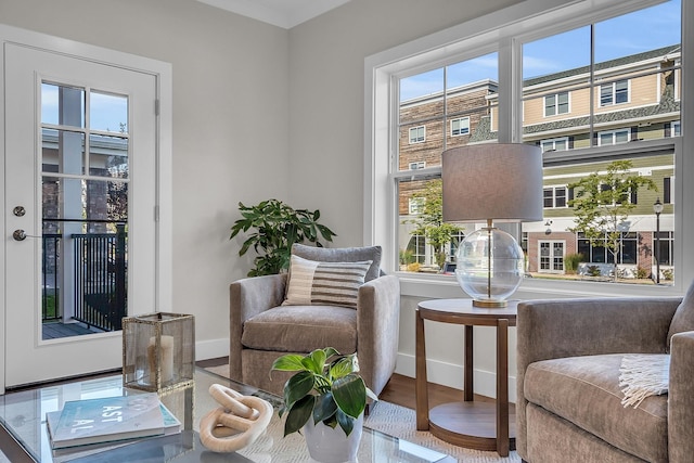 living area with hardwood / wood-style flooring