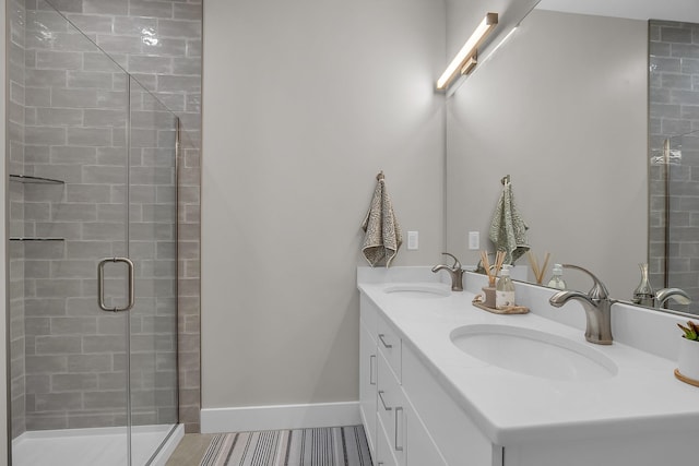 bathroom with tile patterned floors, an enclosed shower, and vanity