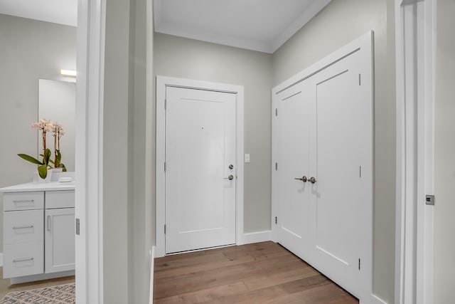 55 Pointe Pl # 106, Dover, NH 03820 - entryway with light wood-style floors and ornamental molding