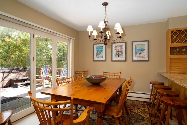 dining area with baseboard heating and an inviting chandelier