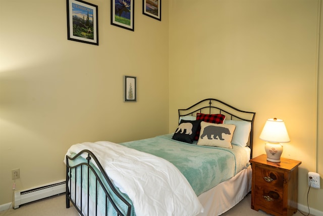 carpeted bedroom with a baseboard heating unit