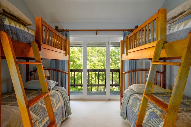 bedroom featuring carpet and access to outside