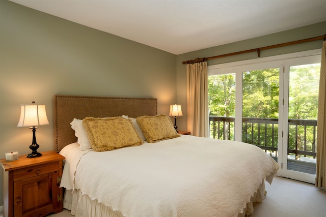 bedroom featuring carpet and access to outside