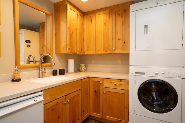 laundry room with sink and stacked washing maching and dryer