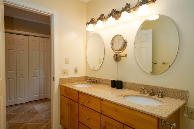 bathroom featuring tile patterned flooring and vanity