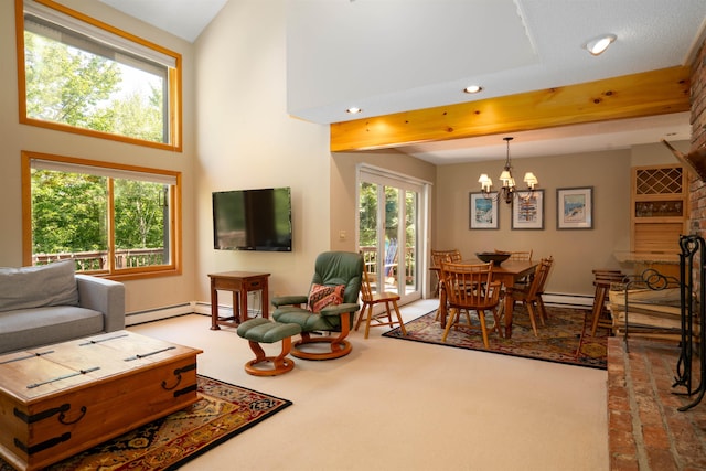 living room with carpet flooring, a baseboard radiator, a notable chandelier, and a towering ceiling