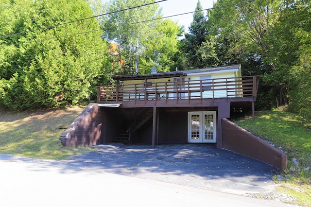 exterior space featuring a deck and french doors