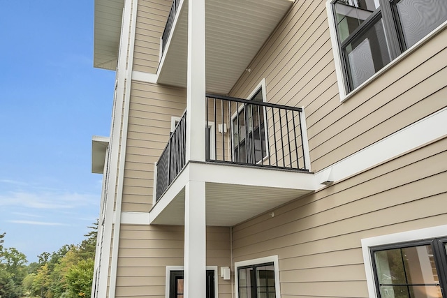 view of home's exterior with a balcony