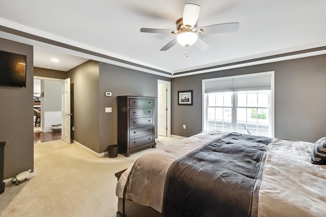 bedroom featuring baseboards, light carpet, and ceiling fan