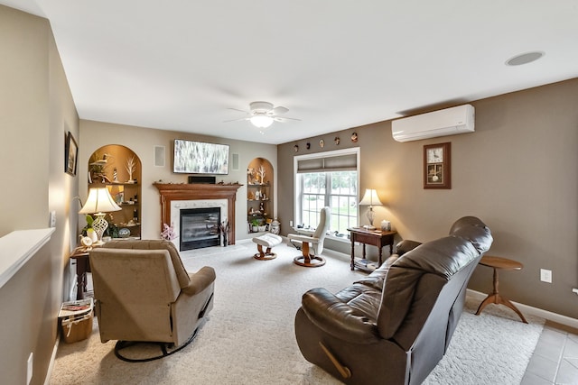 living room featuring a premium fireplace, a ceiling fan, baseboards, and a wall mounted AC