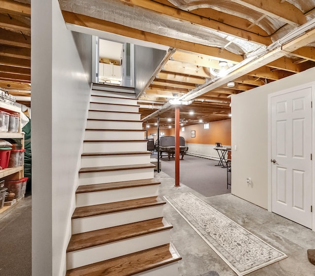 staircase with concrete floors