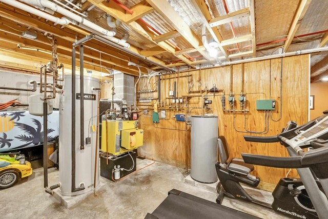 unfinished basement featuring water heater and gas water heater