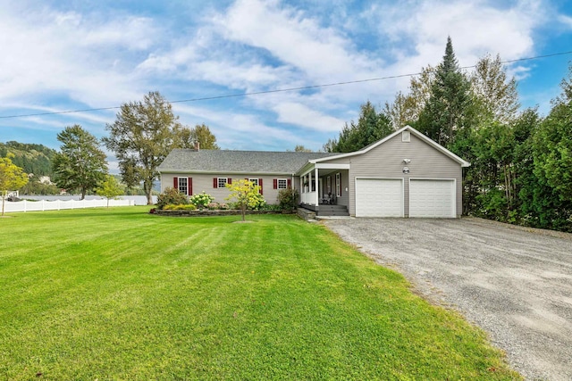 single story home with aphalt driveway, an attached garage, a front lawn, and fence