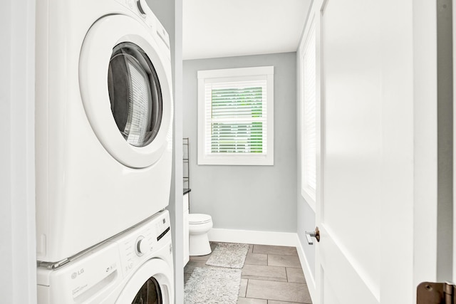 interior space featuring stacked washer / dryer