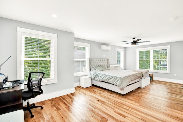 bedroom featuring multiple windows and ceiling fan