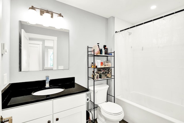 full bathroom featuring vanity, toilet, and shower / bath combination with curtain