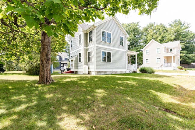 view of front of home featuring a porch and a front lawn